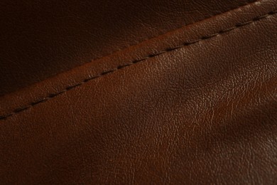 Brown leather with seam as background, above view