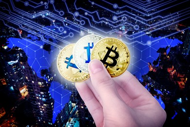 Image of Man holding bitcoins against digital scheme, world map and cityscape, closeup