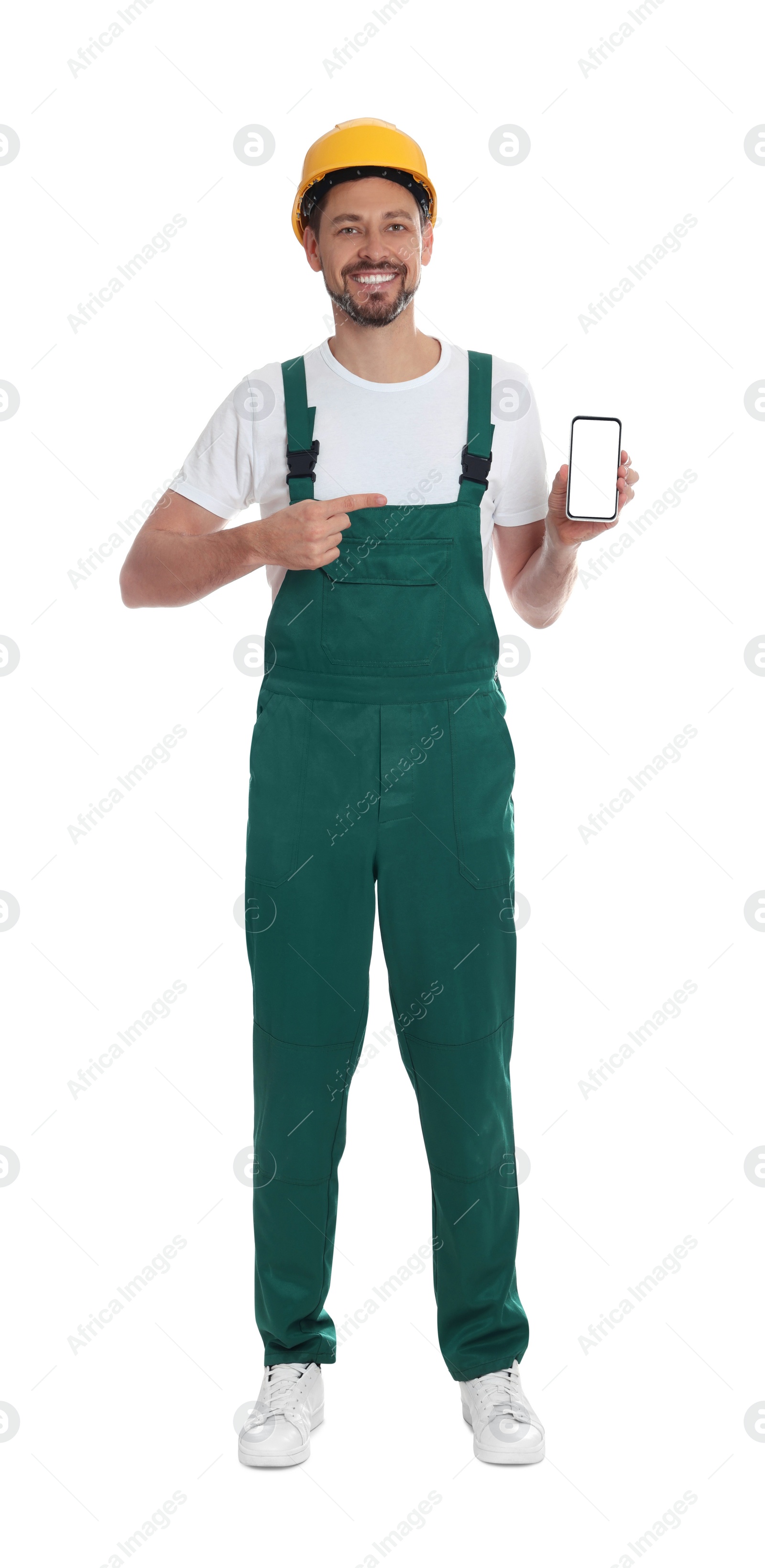 Photo of Professional repairman in uniform with phone on white background