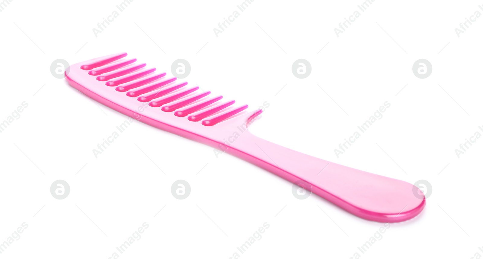 Photo of New pink hair comb isolated on white