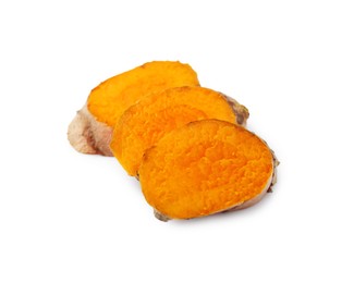 Photo of Slices of fresh turmeric root isolated on white