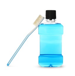 Photo of Bottle with mouthwash and toothbrush on white background