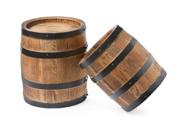 Photo of Two traditional wooden barrels on white background
