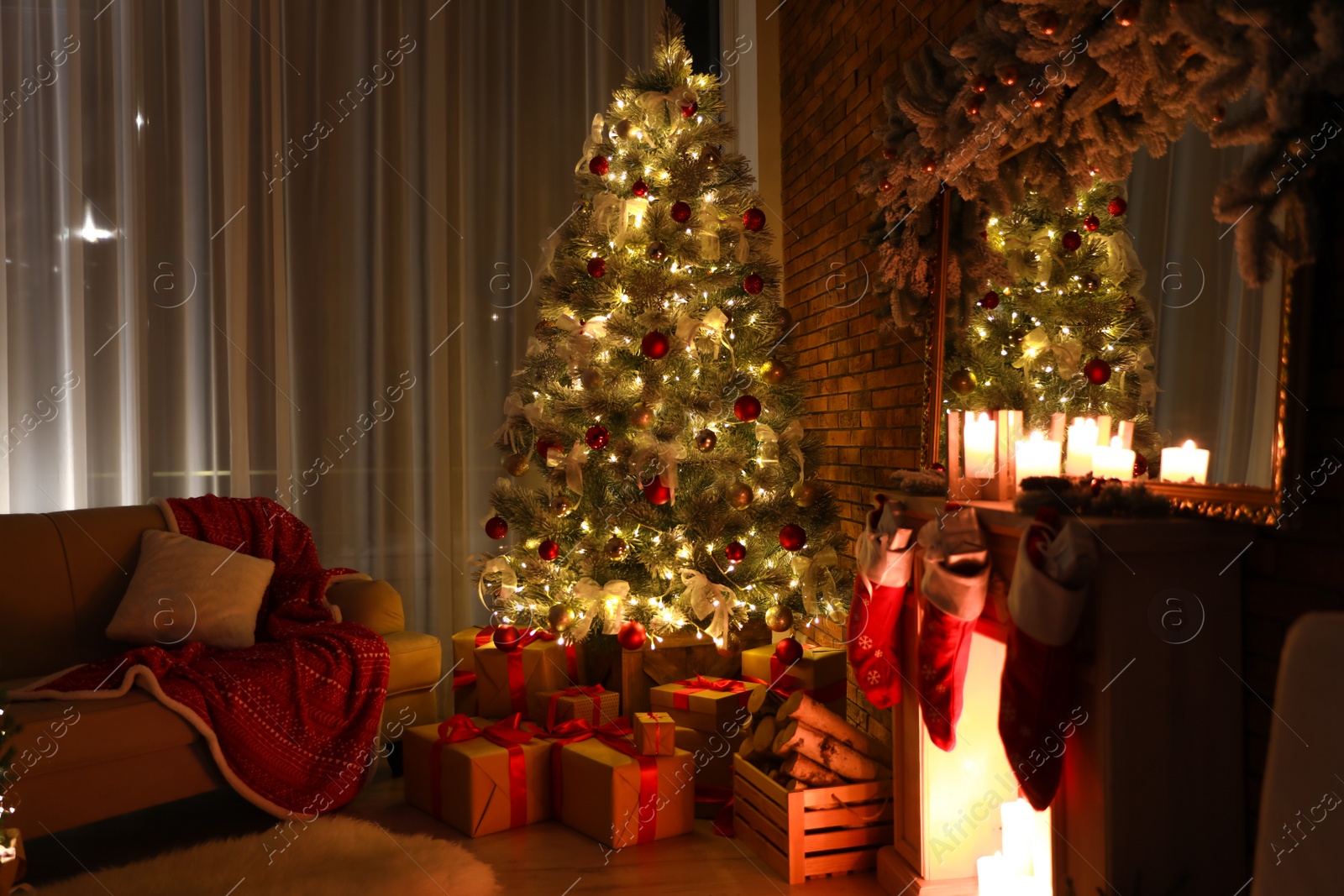 Photo of Stylish room interior with beautiful Christmas tree in evening