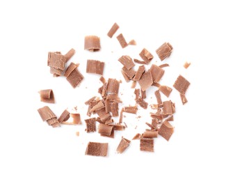 Photo of Many tasty chocolate shavings isolated on white, top view