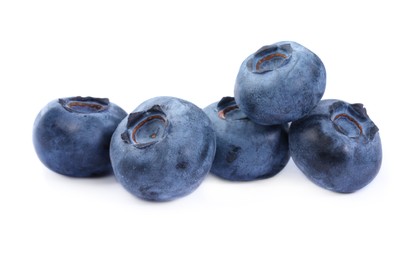 Photo of Many fresh ripe blueberries isolated on white