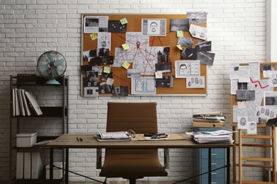 Photo of Modern detective office with workplace and board
