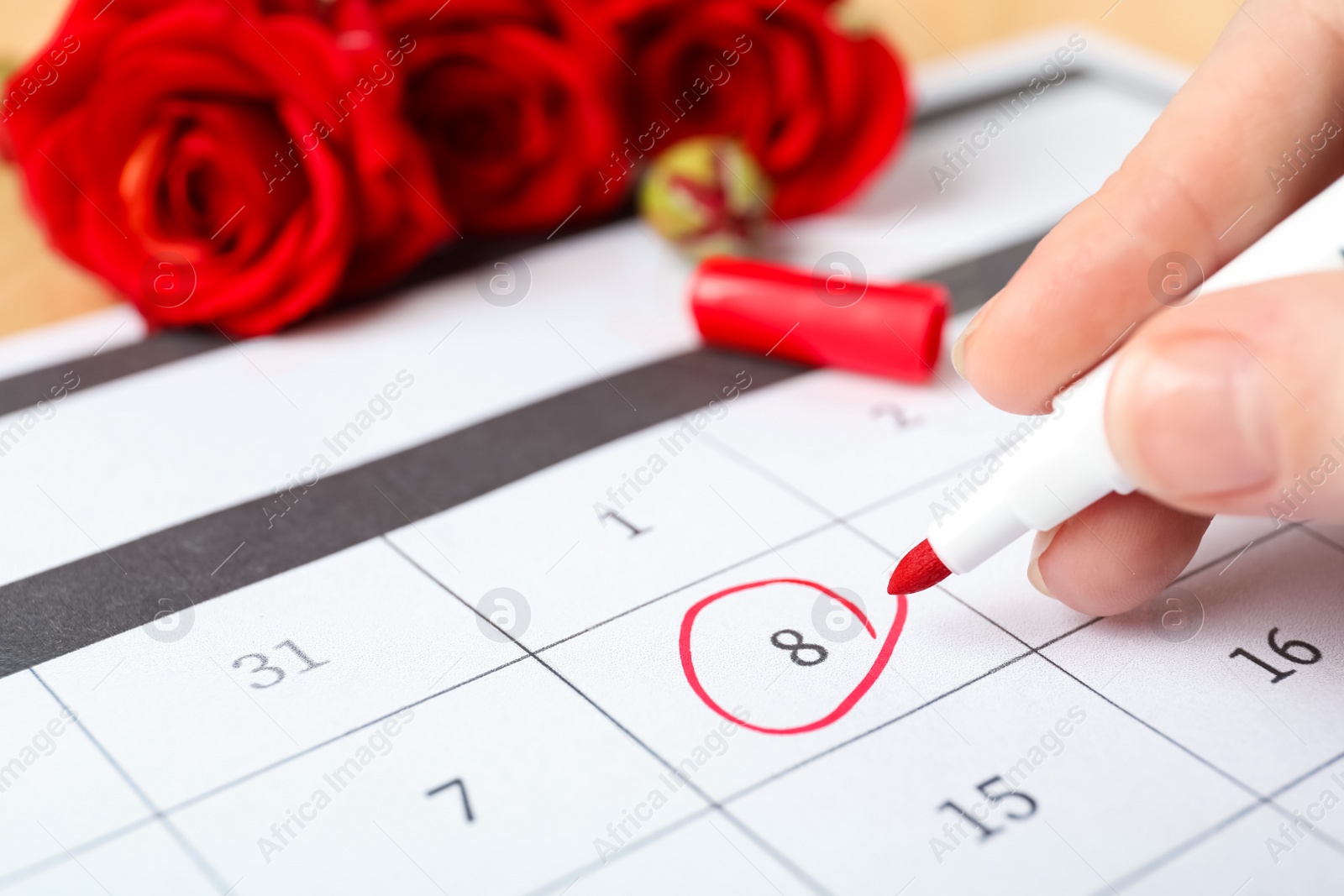 Photo of Person marking date 8th of March in calendar, closeup. International Women's Day