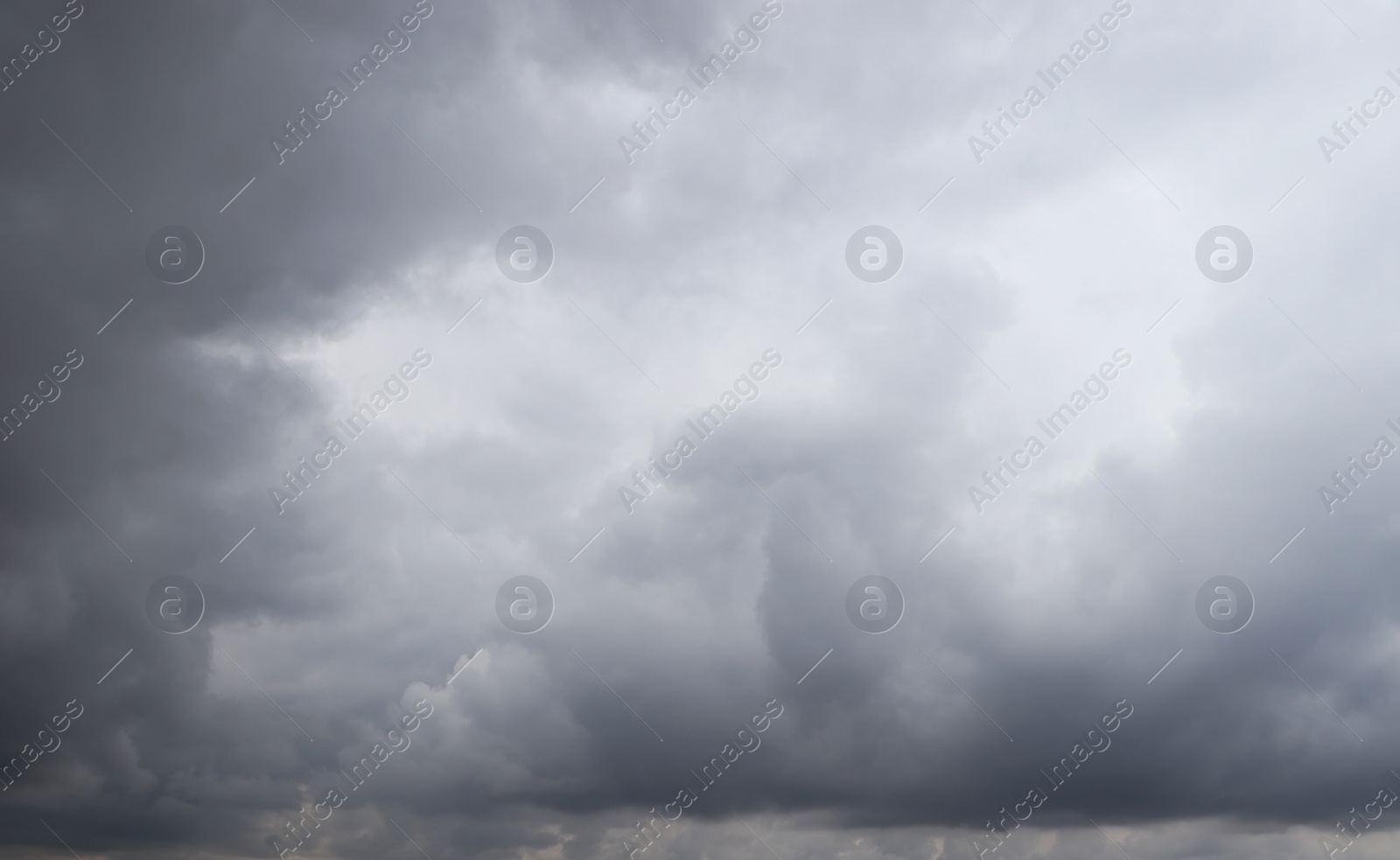 Photo of Sky with heavy rainy clouds on grey day