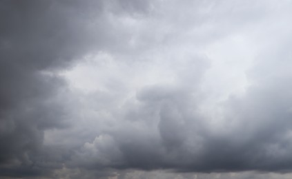 Photo of Sky with heavy rainy clouds on grey day