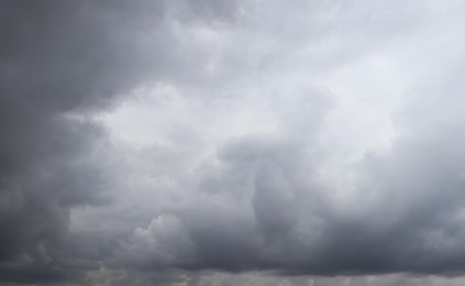 Sky with heavy rainy clouds on grey day