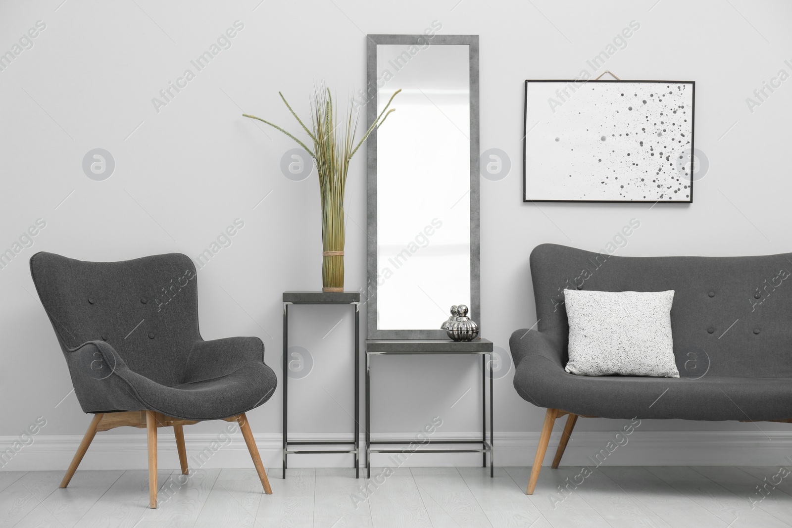 Photo of Modern mirror near white wall in stylish living room