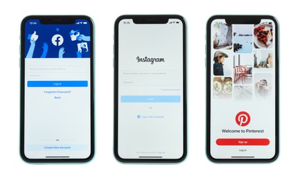 Image of MYKOLAIV, UKRAINE - JULY 07, 2020: New modern iPhone 11 with Facebook, Instagram and Pinterest apps on screens against white background