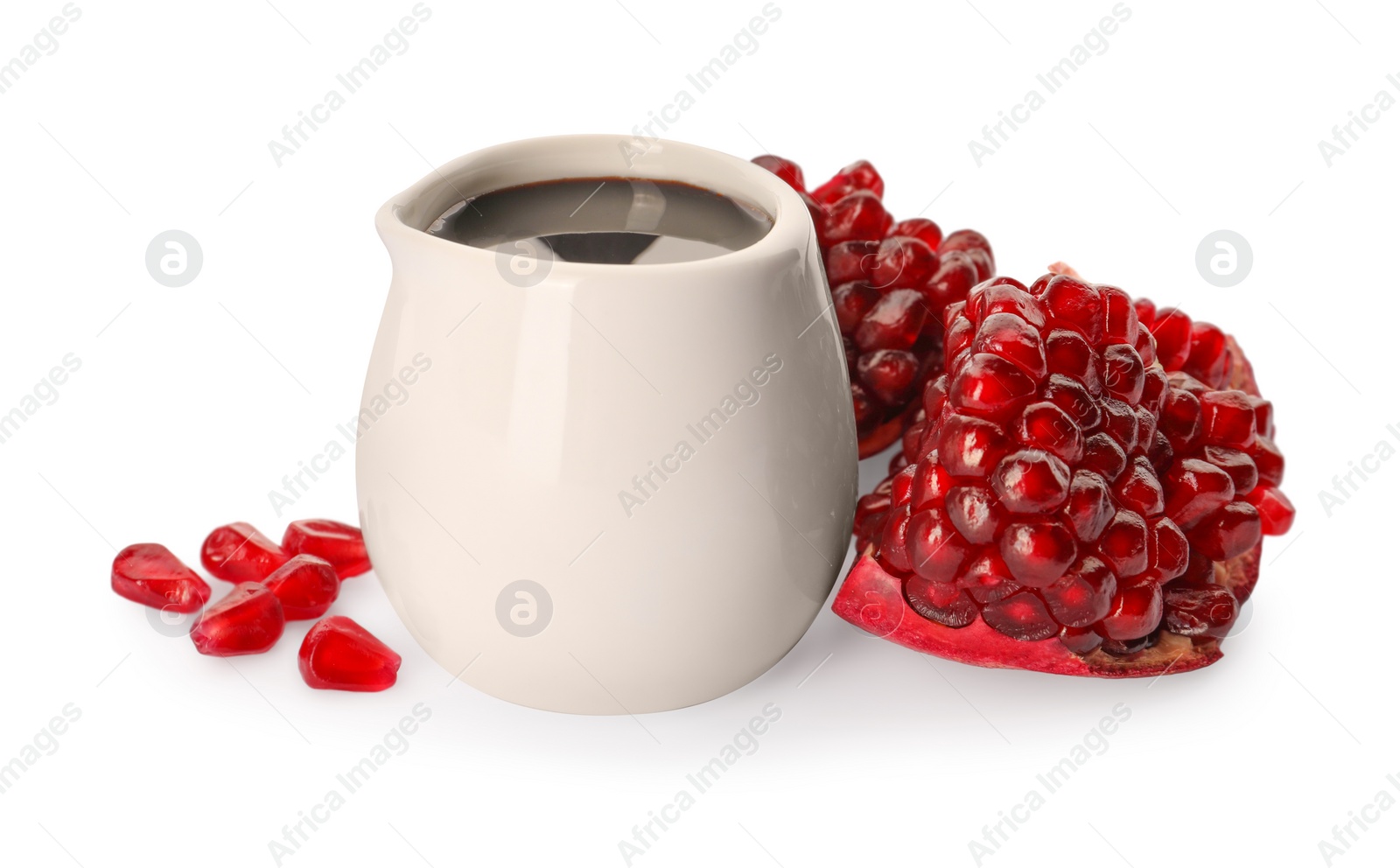 Photo of Tasty pomegranate sauce and fresh ripe fruit on white background