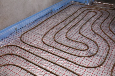 Installation of underfloor heating system in building