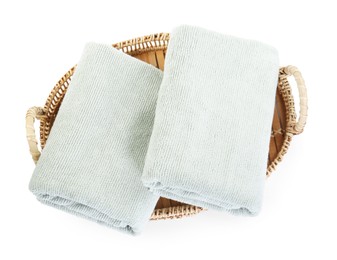 Photo of Basket with soft towels isolated on white, top view