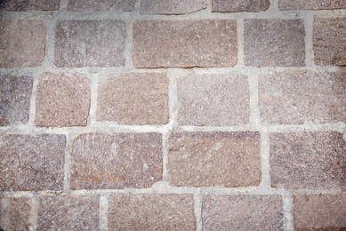 Photo of Pavement made of tiles as background, above view