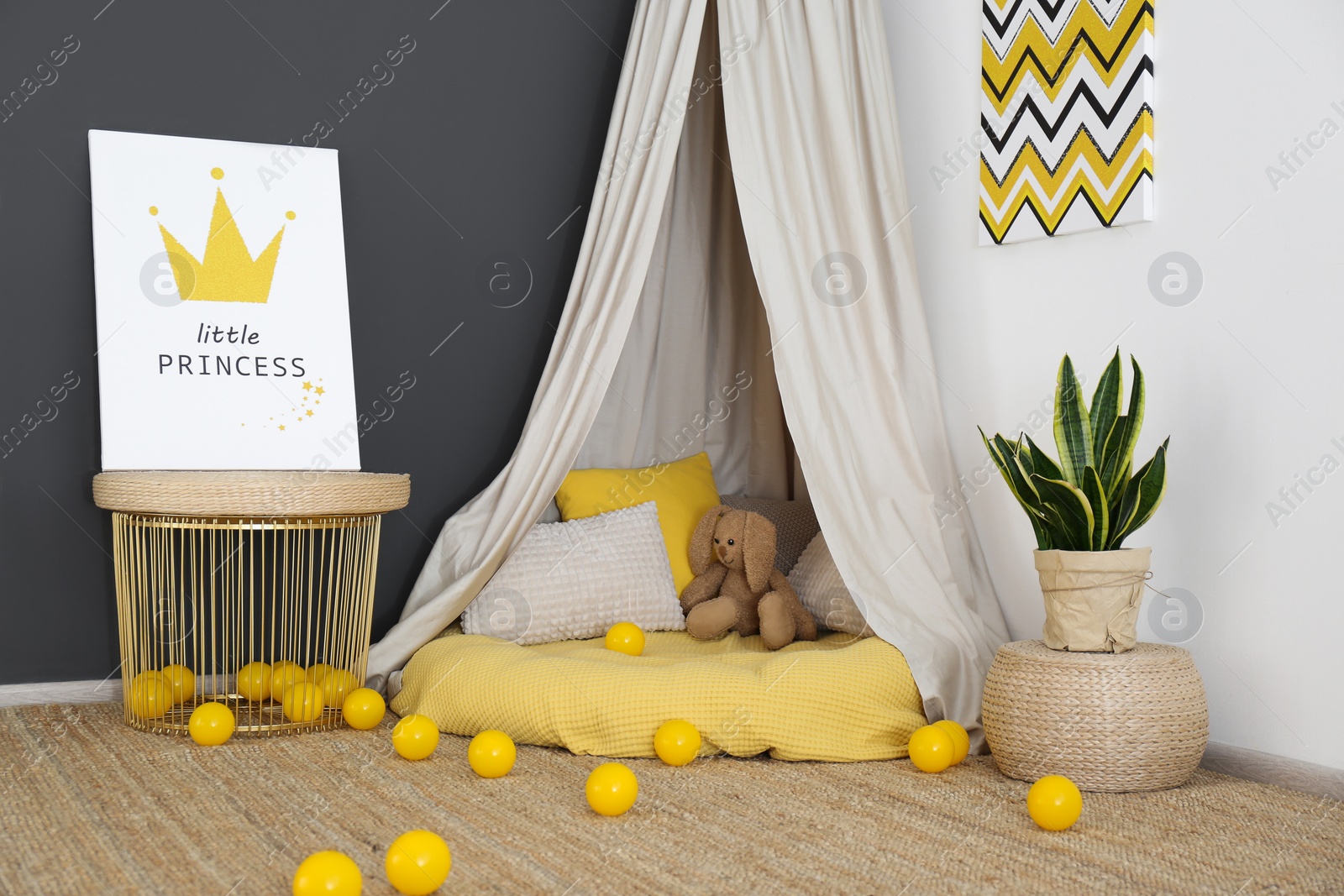 Photo of Baby room interior with play tent and cute posters