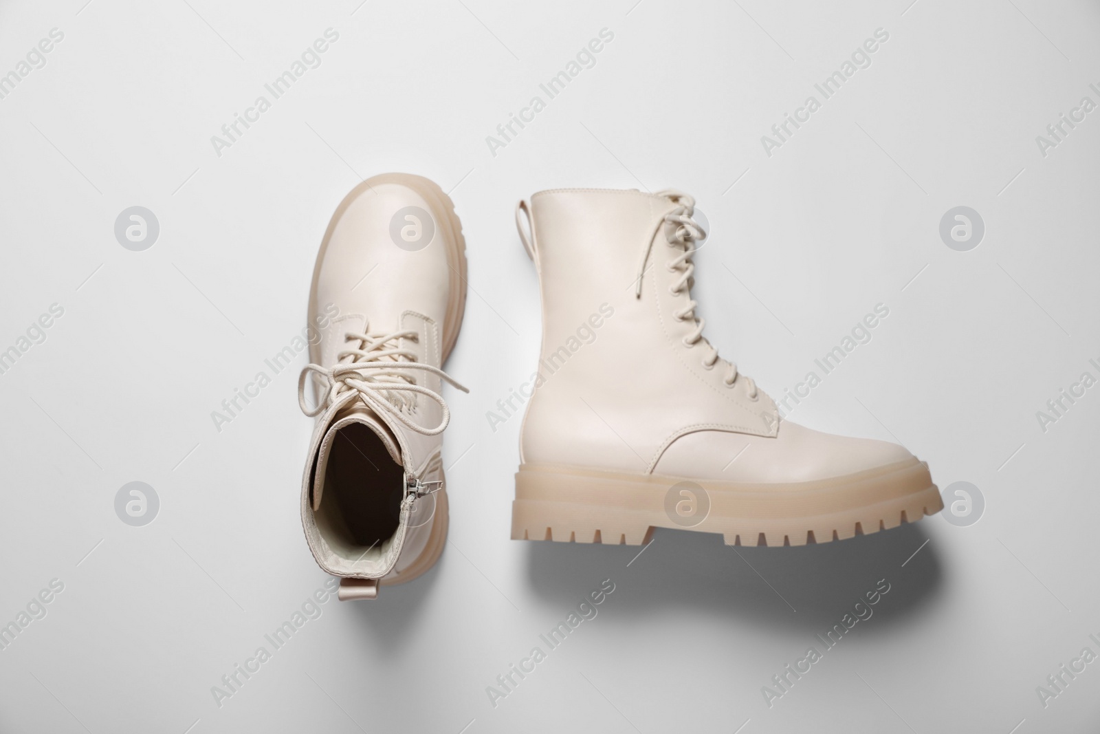 Photo of Pair of stylish leather shoes on beige background, flat lay