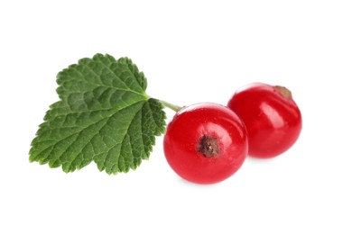 Photo of Fresh ripe red currant berries and green leaf isolated on white