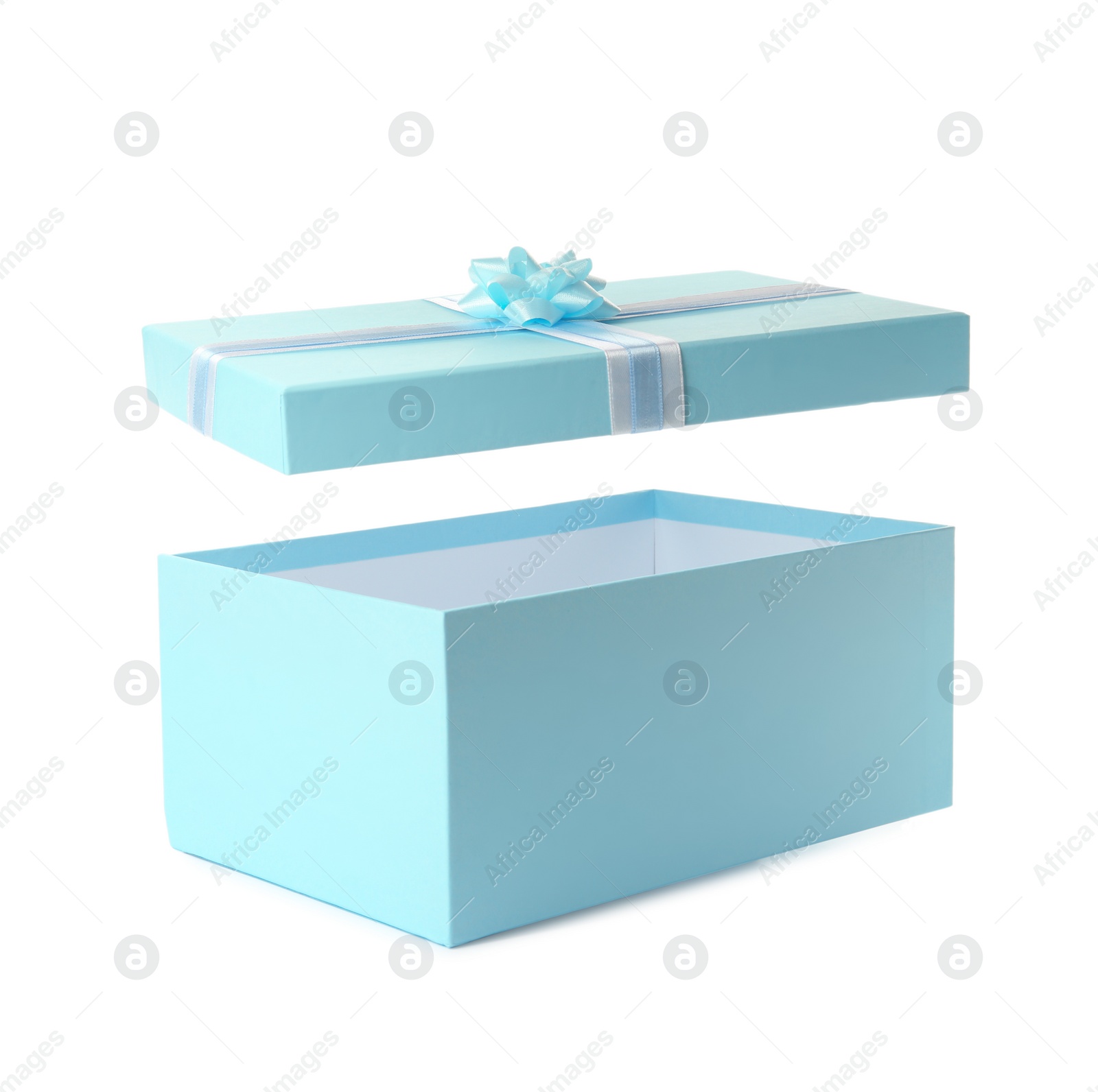 Photo of Light blue gift box and lid with bow on white background