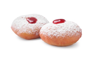 Photo of Hanukkah donuts with jelly and powdered sugar isolated on white