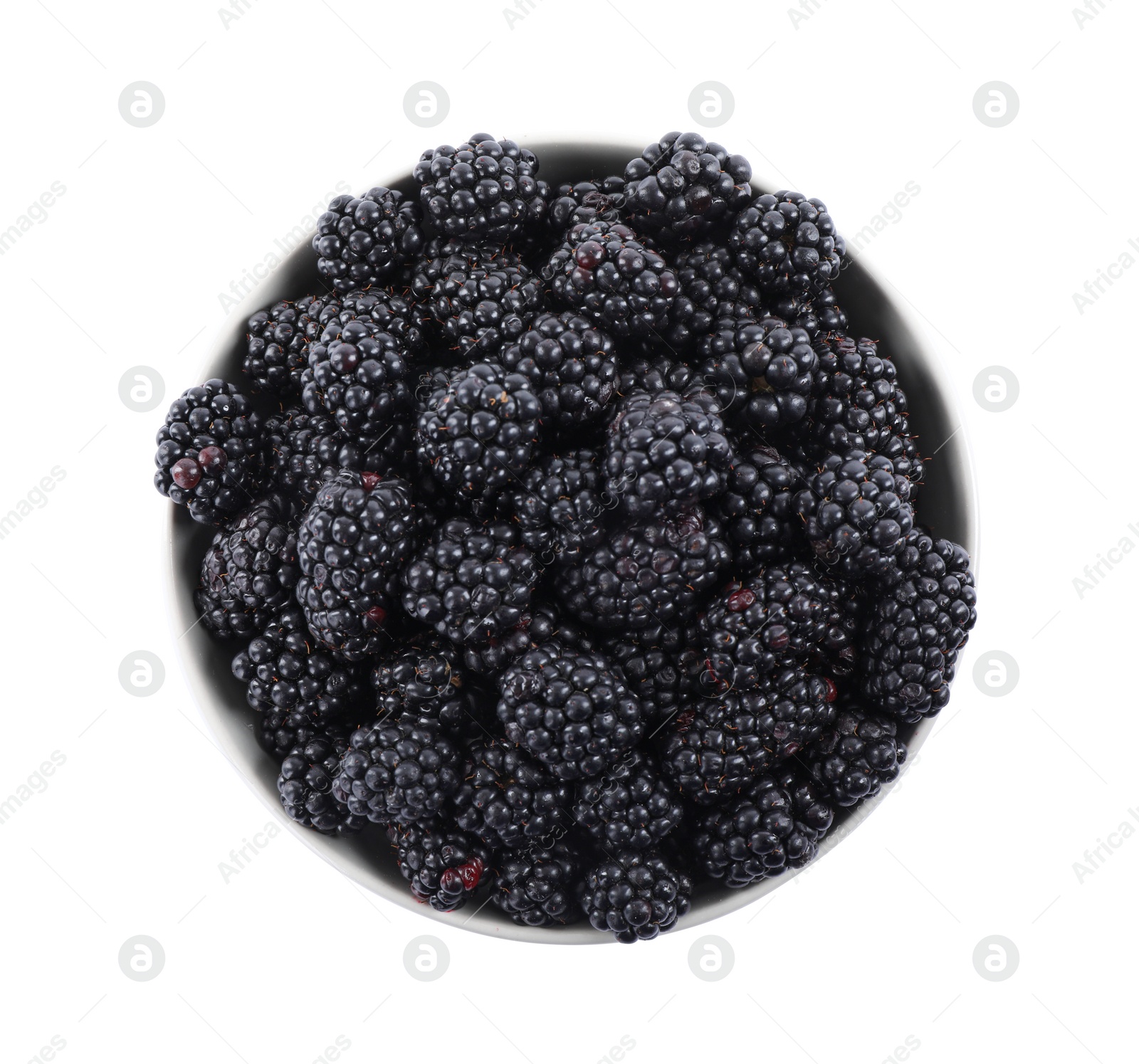 Photo of Fresh ripe blackberries in bowl isolated on white, top view