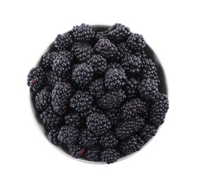 Photo of Fresh ripe blackberries in bowl isolated on white, top view