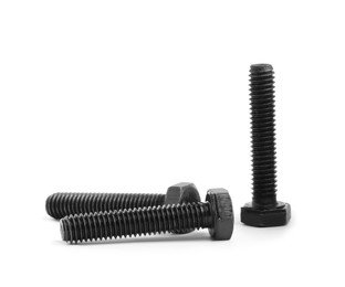 Photo of Three black metal hex bolts on white background