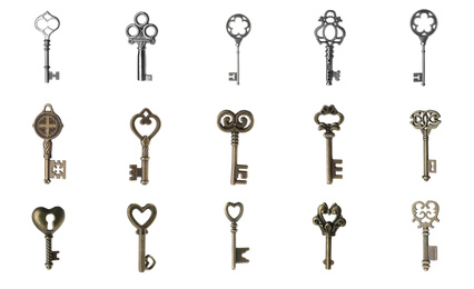 Set of different ornate keys on white background