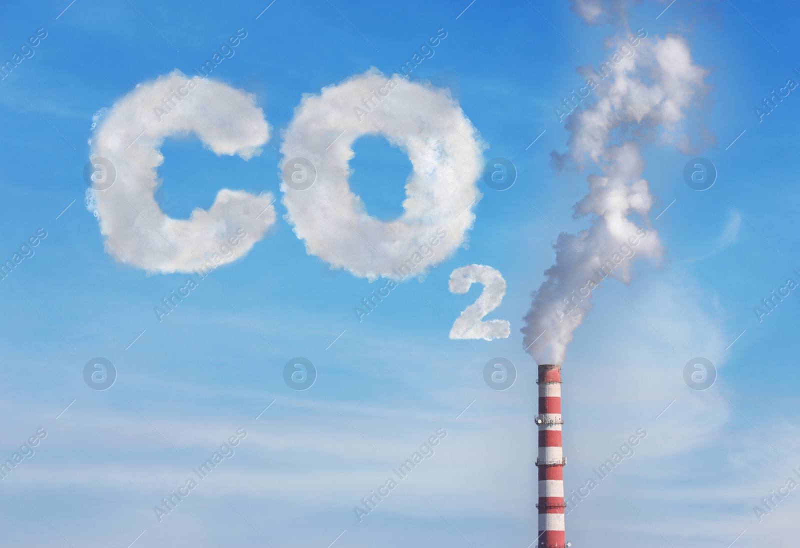 Image of  Inscription CO2 made of smoke. Polluting air from industrial chimney outdoors against blue sky 