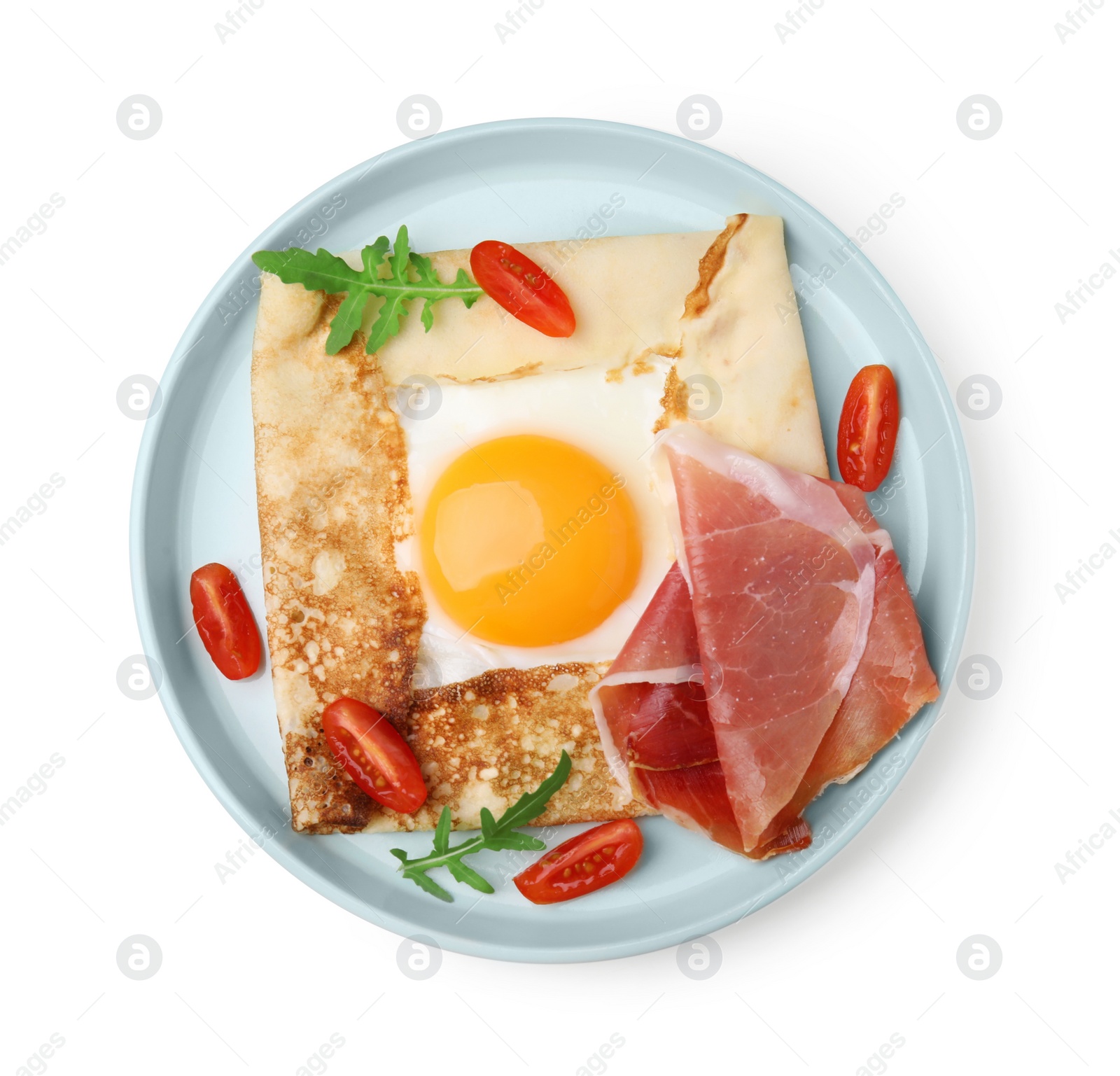 Photo of Delicious crepe with egg isolated on white, top view. Breton galette