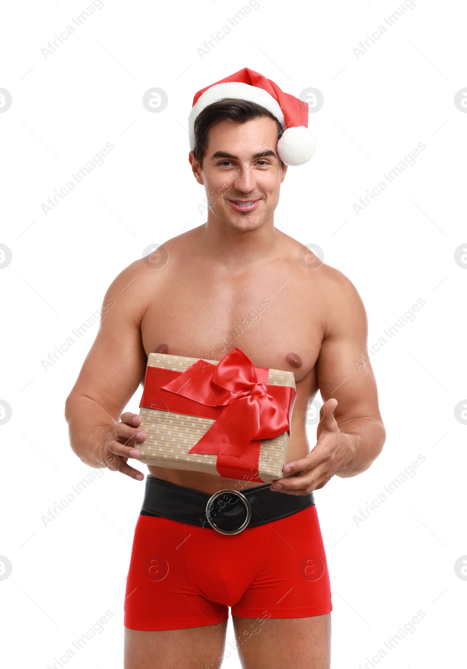 Photo of Sexy shirtless Santa Claus with gift on white background