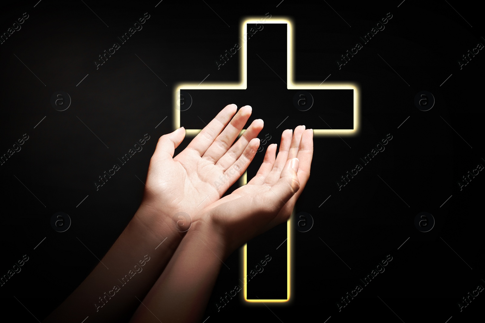 Image of Christian cross and woman stretching hands towards light in darkness, closeup