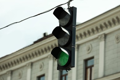 Photo of View of traffic light in city on sunny day