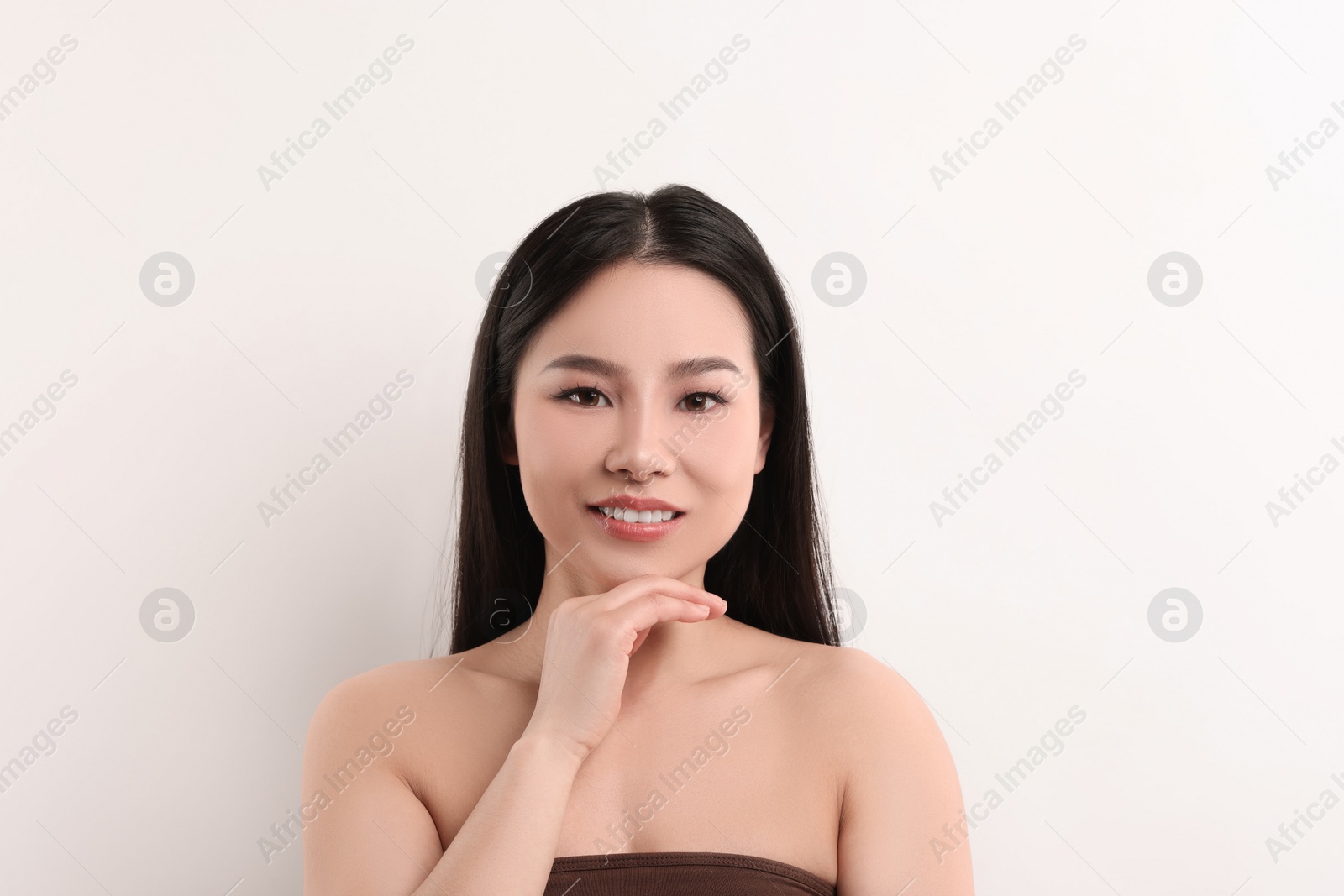 Photo of Portrait of beautiful woman on white background