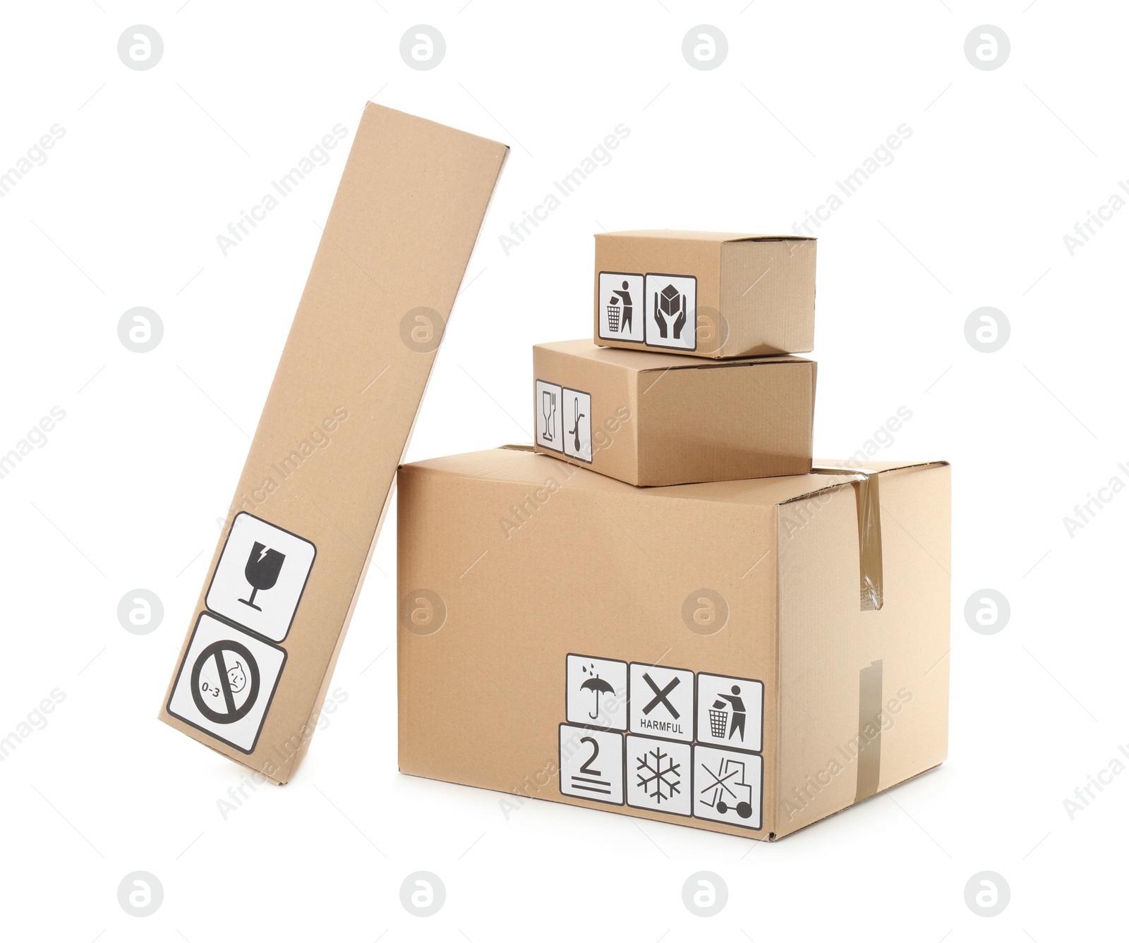 Photo of Cardboard boxes with different packaging symbols on white background. Parcel delivery