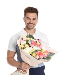 Young handsome man with beautiful flower bouquet on white background