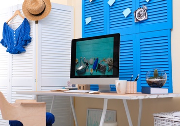 Photo of Home workplace with modern computer and desk in room