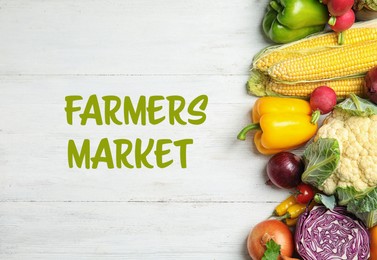 Flat lay composition with assortment of fresh vegetables on wooden background. Farmers market