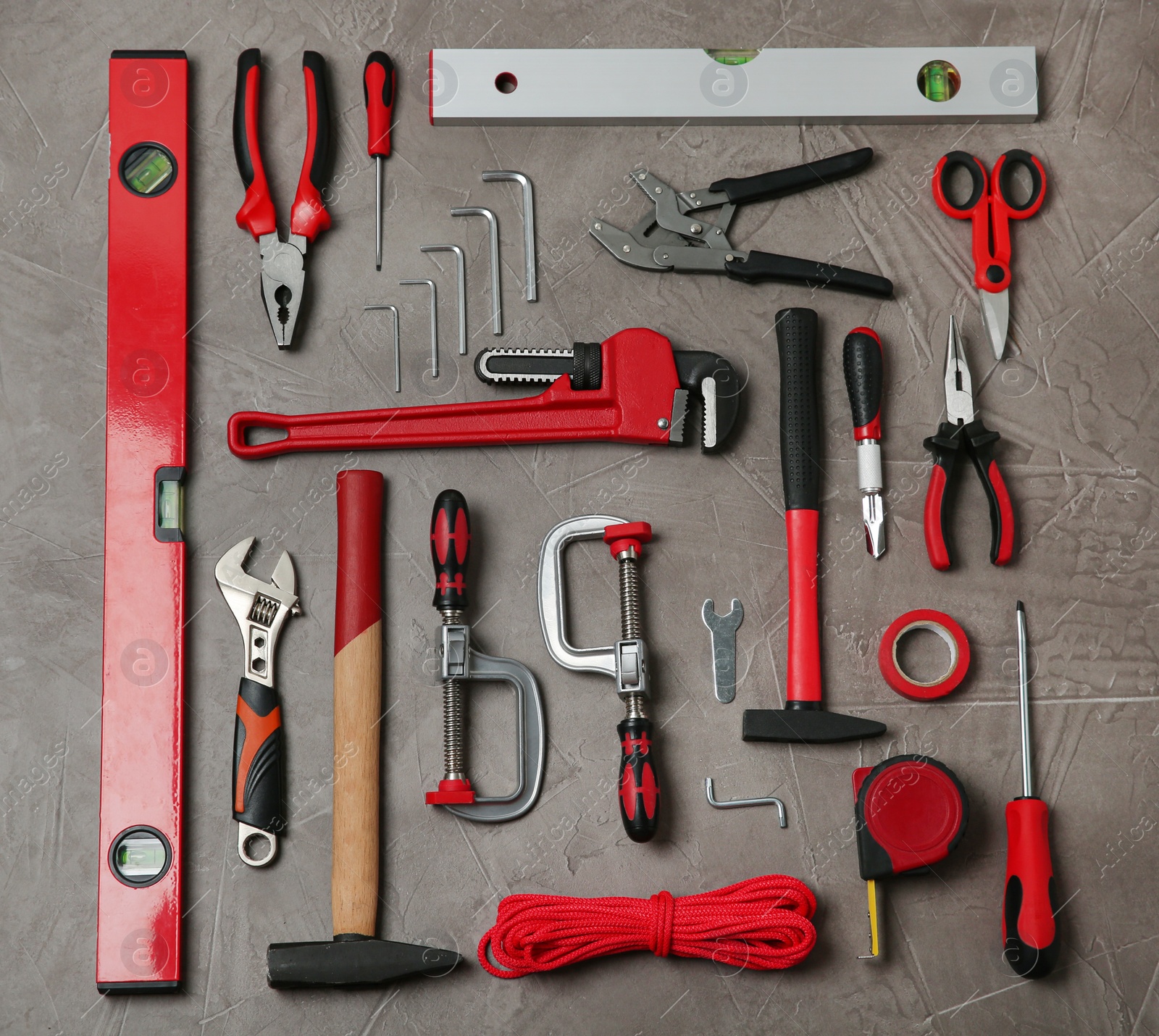 Photo of Flat lay composition with repair tools on grey stone table