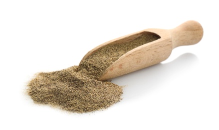 Wooden scoop with pepper powder on white background