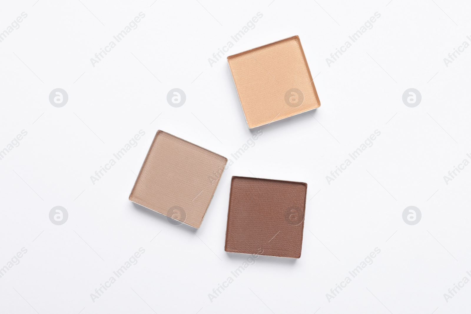 Photo of Beautiful eye shadow refill pans on white background, flat lay