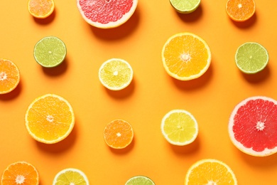 Photo of Different citrus fruits on color background, flat lay