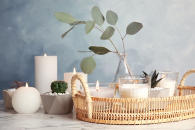 Photo of Beautiful composition with burning candles on table