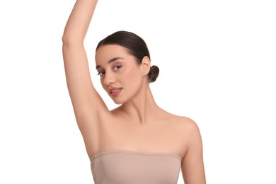 Beautiful woman showing armpit with smooth clean skin on white background