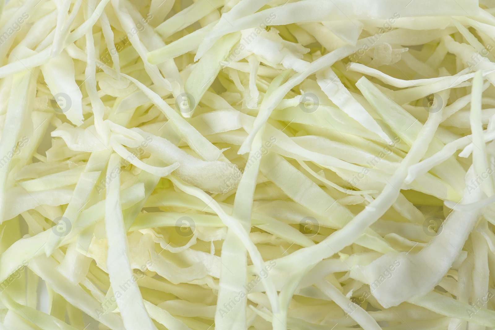 Photo of Chopped fresh ripe cabbage as background, closeup