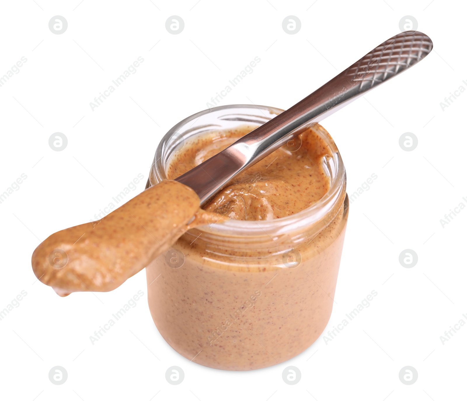 Photo of Tasty nut paste in jar and knife isolated on white