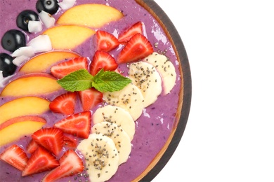 Healthy breakfast with delicious acai smoothie and fruits in bowl on white background, top view