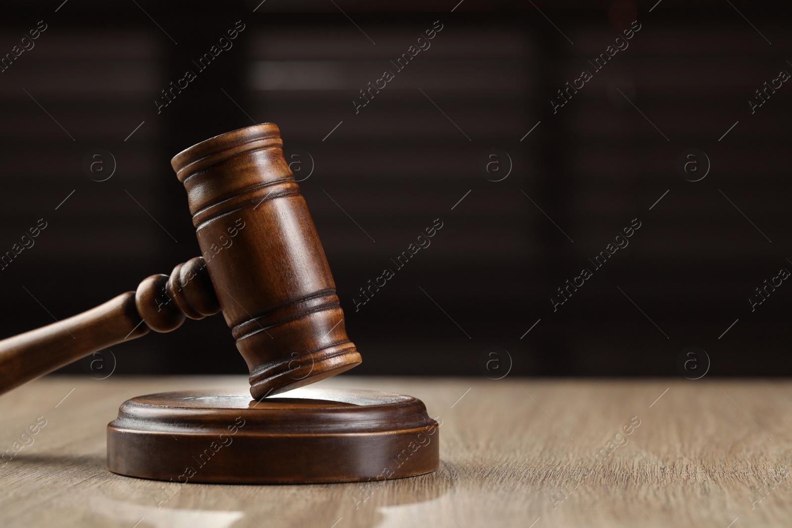 Photo of Wooden gavel on table. Space for text